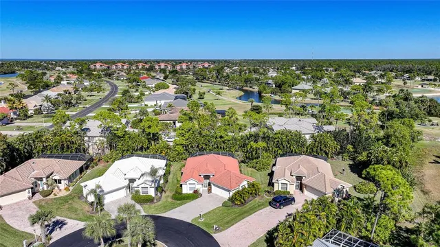 an aerial view of a house with garden space and street view