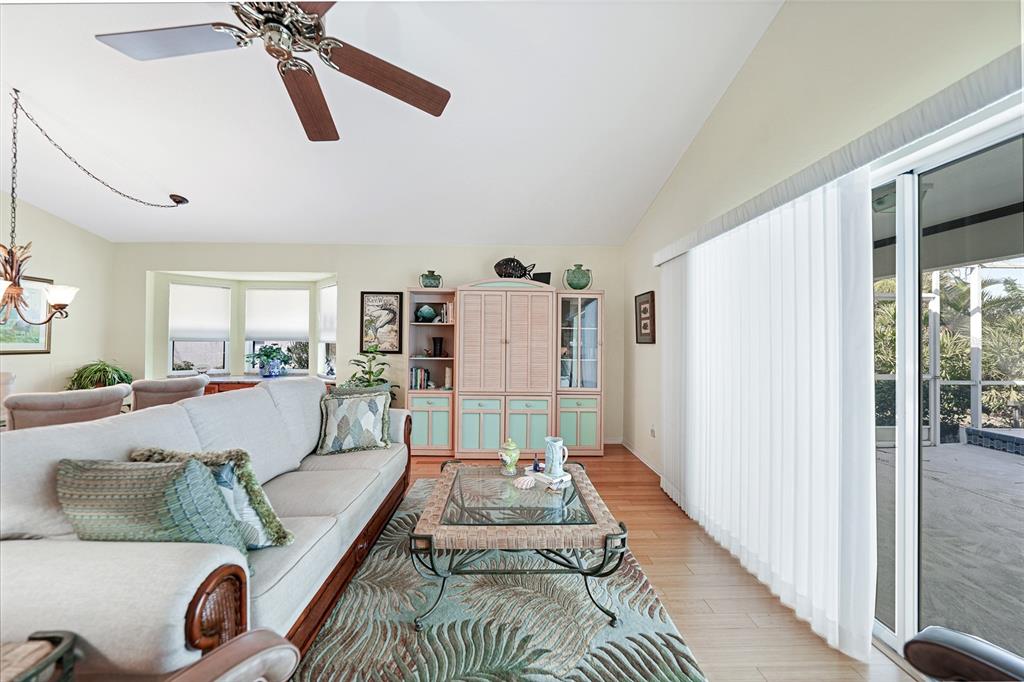425 Islamorada Boulevard Punta Gorda, FL 33955 - Photo 7 of 44 a living room with furniture and a wooden floor