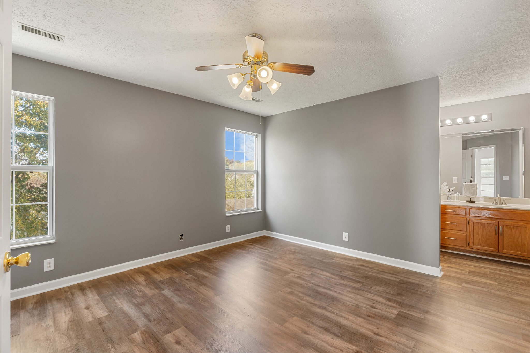 1068 Tulip Grove Road Hermitage, TN 37076 - Photo 56 of 100 an empty room with window and wooden floor