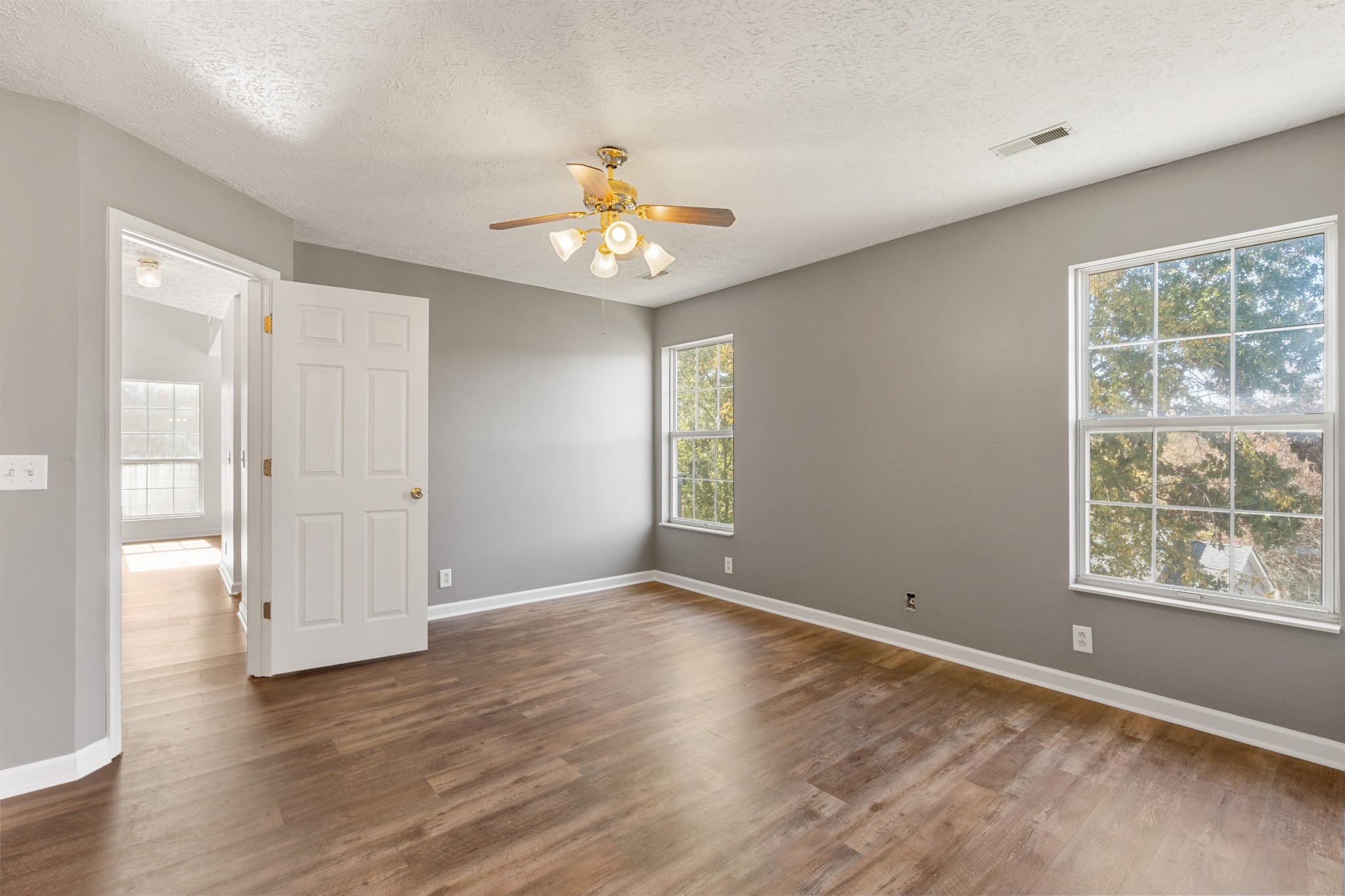1068 Tulip Grove Road Hermitage, TN 37076 - Photo 57 of 100 an empty room with wooden floor and window