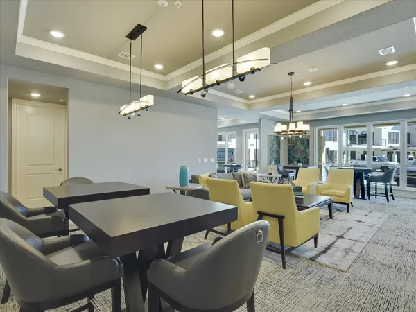 a view of a dining room with furniture and chandelier