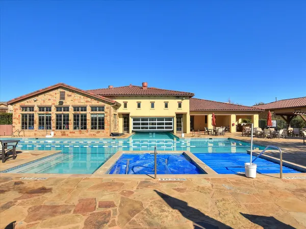 a view of swimming pool with outdoor seating