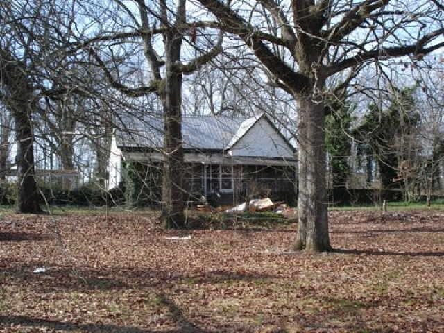 4567 Salem Road Covington, GA 30016 - Photo 1 of 1 a view of a house with a tree in the yard