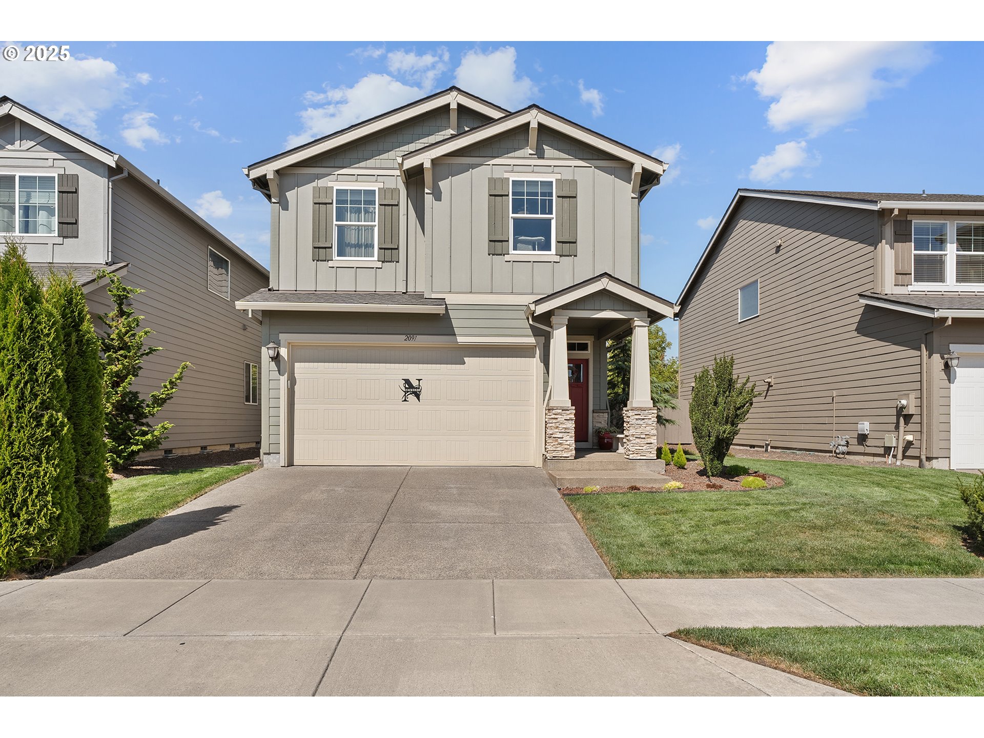 2091 35th Avenue Forest Grove, OR 97116 - Photo 1 of 43 a front view of a house with a yard and garage