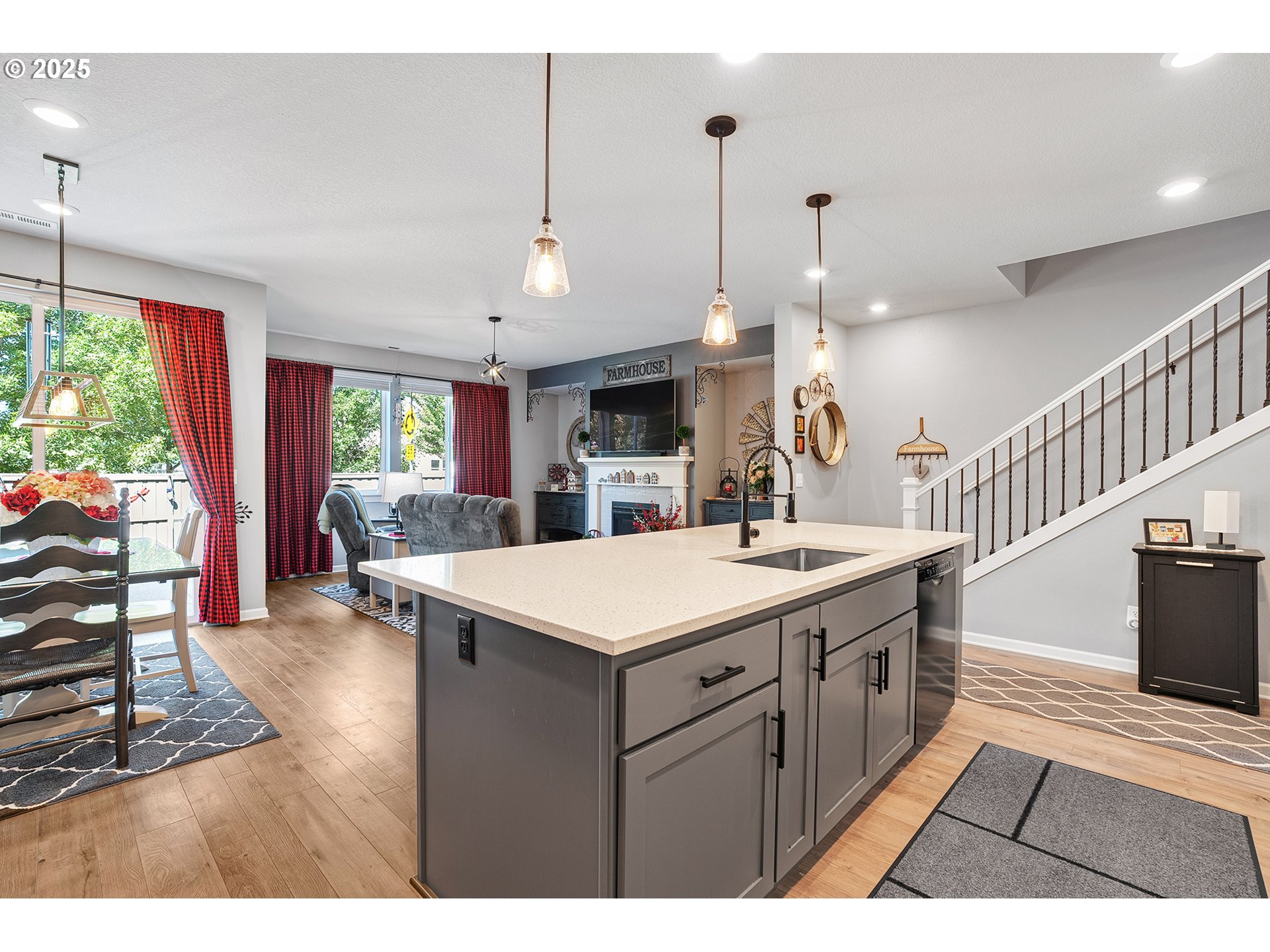 2091 35th Avenue Forest Grove, OR 97116 - Photo 11 of 43 a kitchen with a sink a counter top space and a view of living room