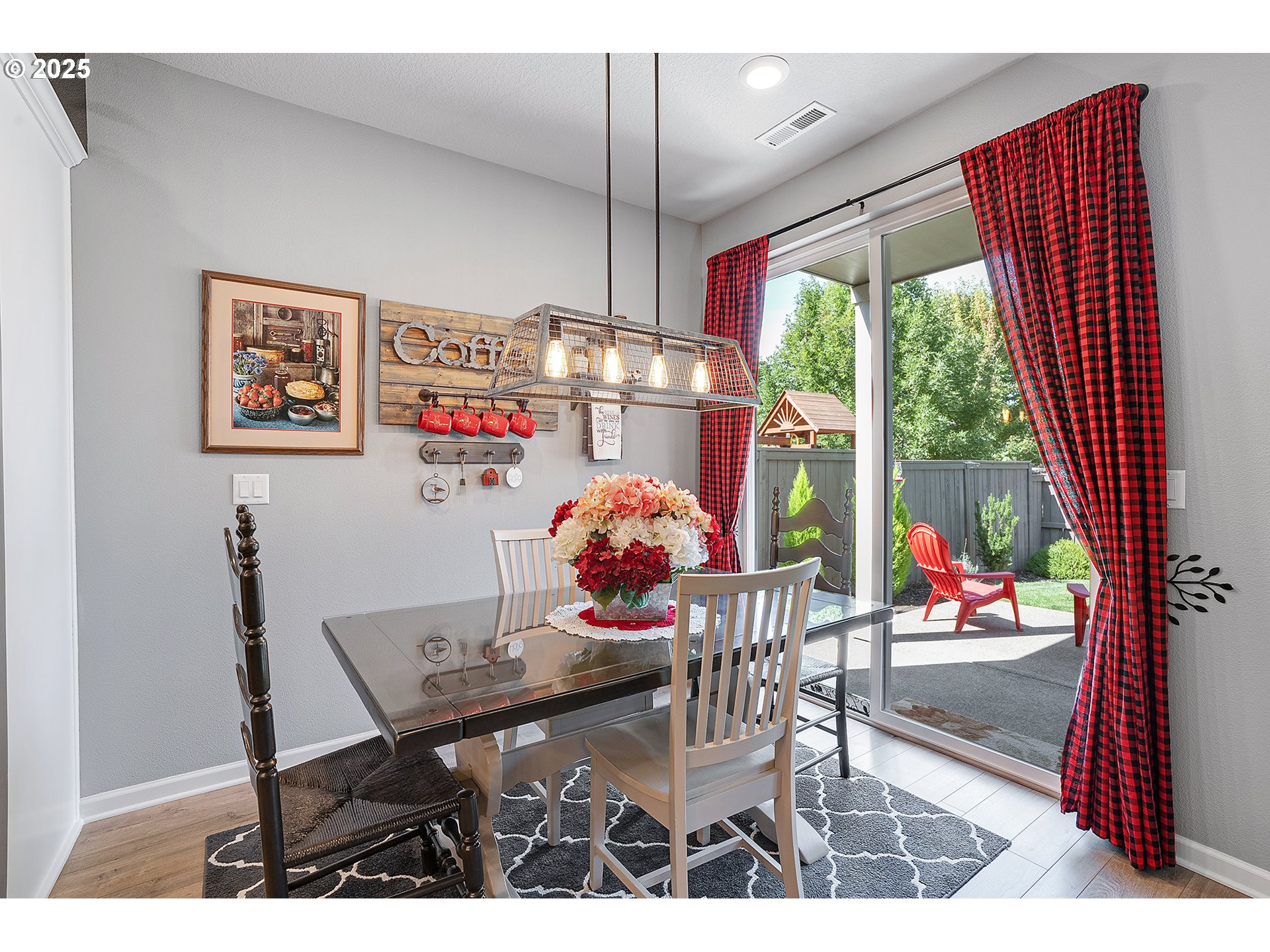 2091 35th Avenue Forest Grove, OR 97116 - Photo 12 of 43 a view of a dining room with furniture large windows and wooden floor