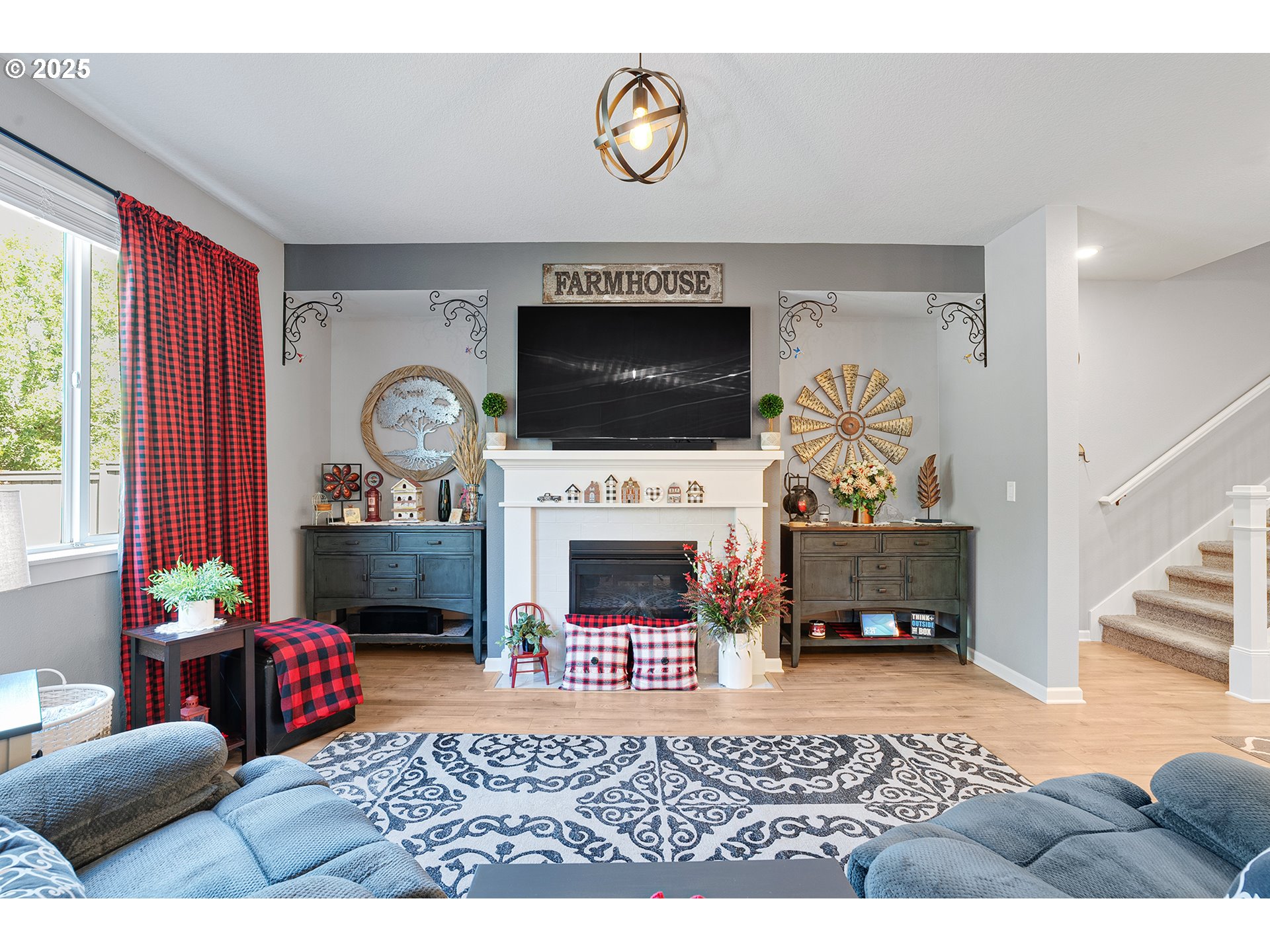 2091 35th Avenue Forest Grove, OR 97116 - Photo 16 of 43 a living room with furniture a fireplace and a flat screen tv
