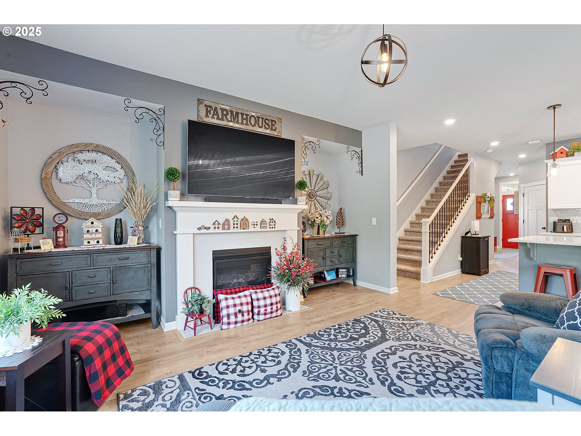2091 35th Avenue Forest Grove, OR 97116 - Photo 17 of 43 a living room with furniture a flat screen tv and a fireplace