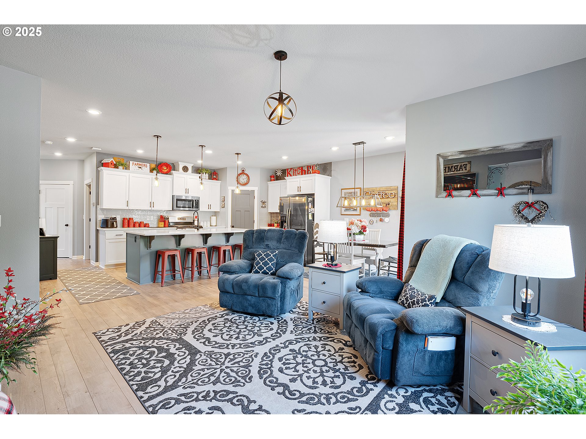 2091 35th Avenue Forest Grove, OR 97116 - Photo 18 of 43 a living room with furniture and a chandelier