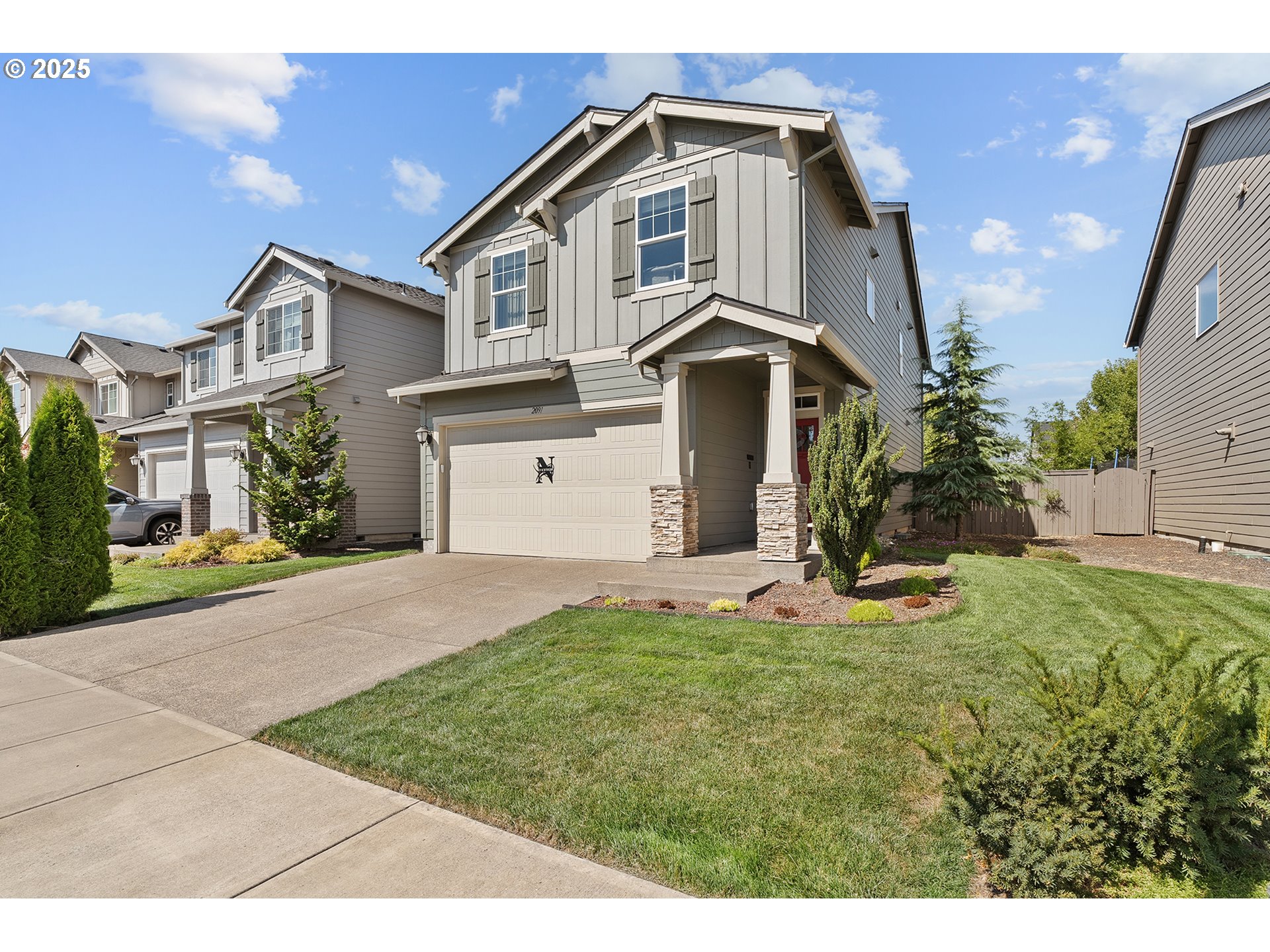 2091 35th Avenue Forest Grove, OR 97116 - Photo 2 of 43 a front view of a house with a yard