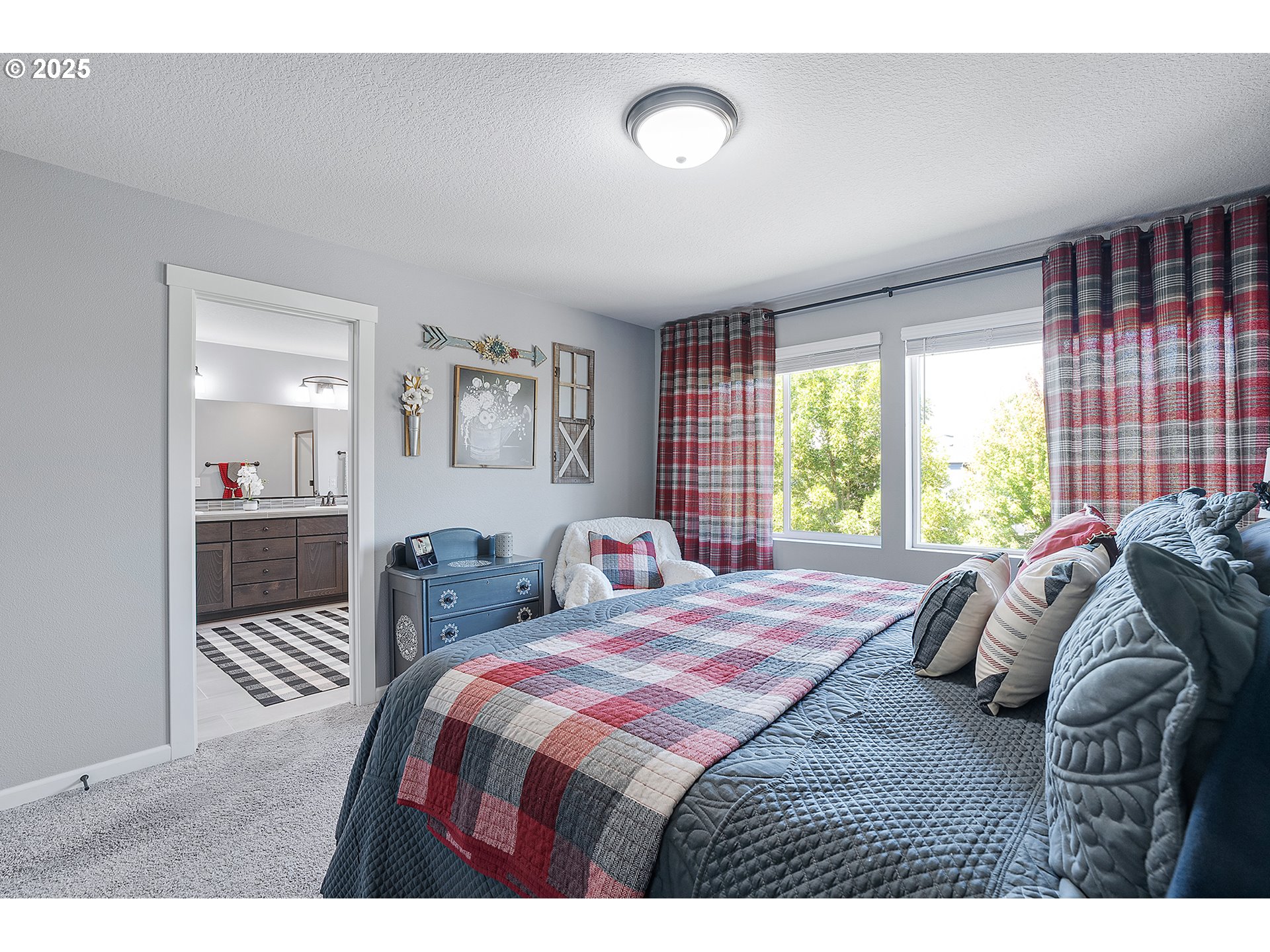 2091 35th Avenue Forest Grove, OR 97116 - Photo 23 of 43 a bedroom with a bed and glass windows