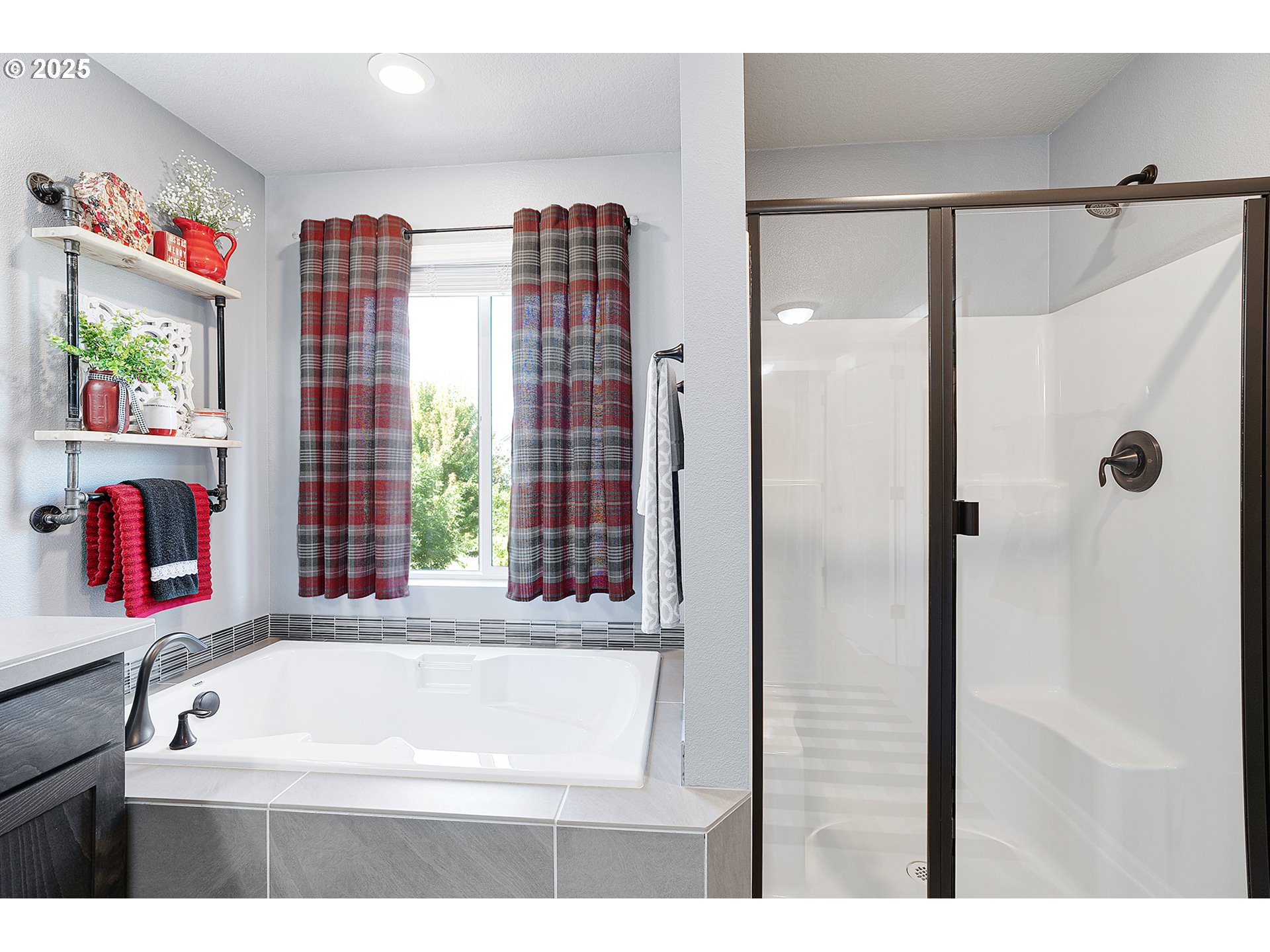 2091 35th Avenue Forest Grove, OR 97116 - Photo 27 of 43 a bathroom with a bathtub and a shower
