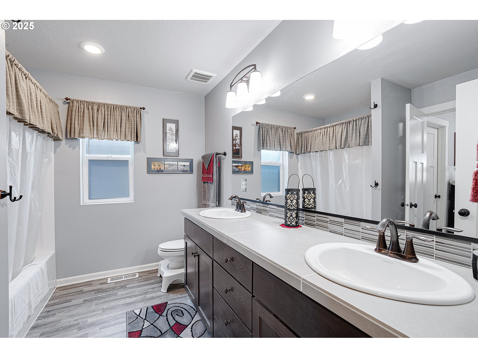 2091 35th Avenue Forest Grove, OR 97116 - Photo 31 of 43 a bathroom with a sink double vanity granite and a mirror