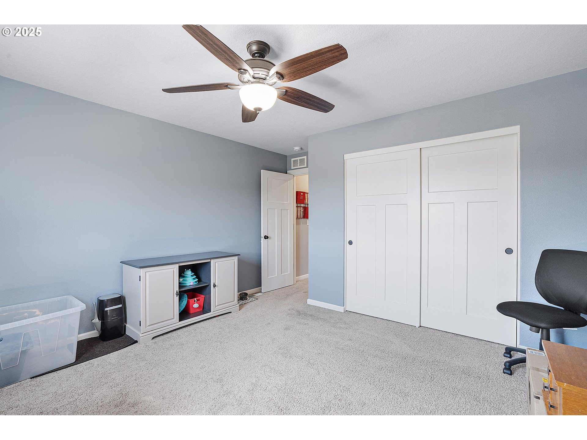 2091 35th Avenue Forest Grove, OR 97116 - Photo 33 of 43 a view of a livingroom with a ceiling fan and a wooden floor