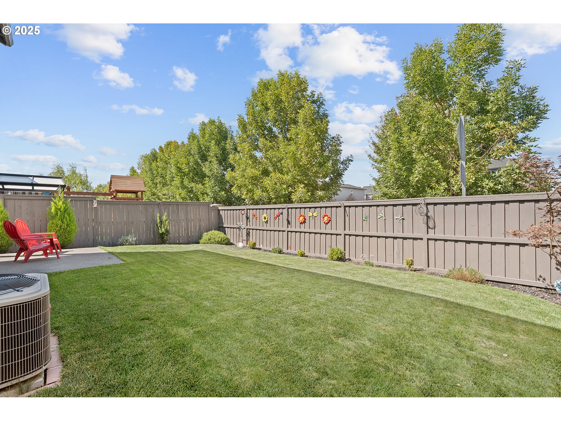 2091 35th Avenue Forest Grove, OR 97116 - Photo 38 of 43 a view of a backyard with a fence and plants