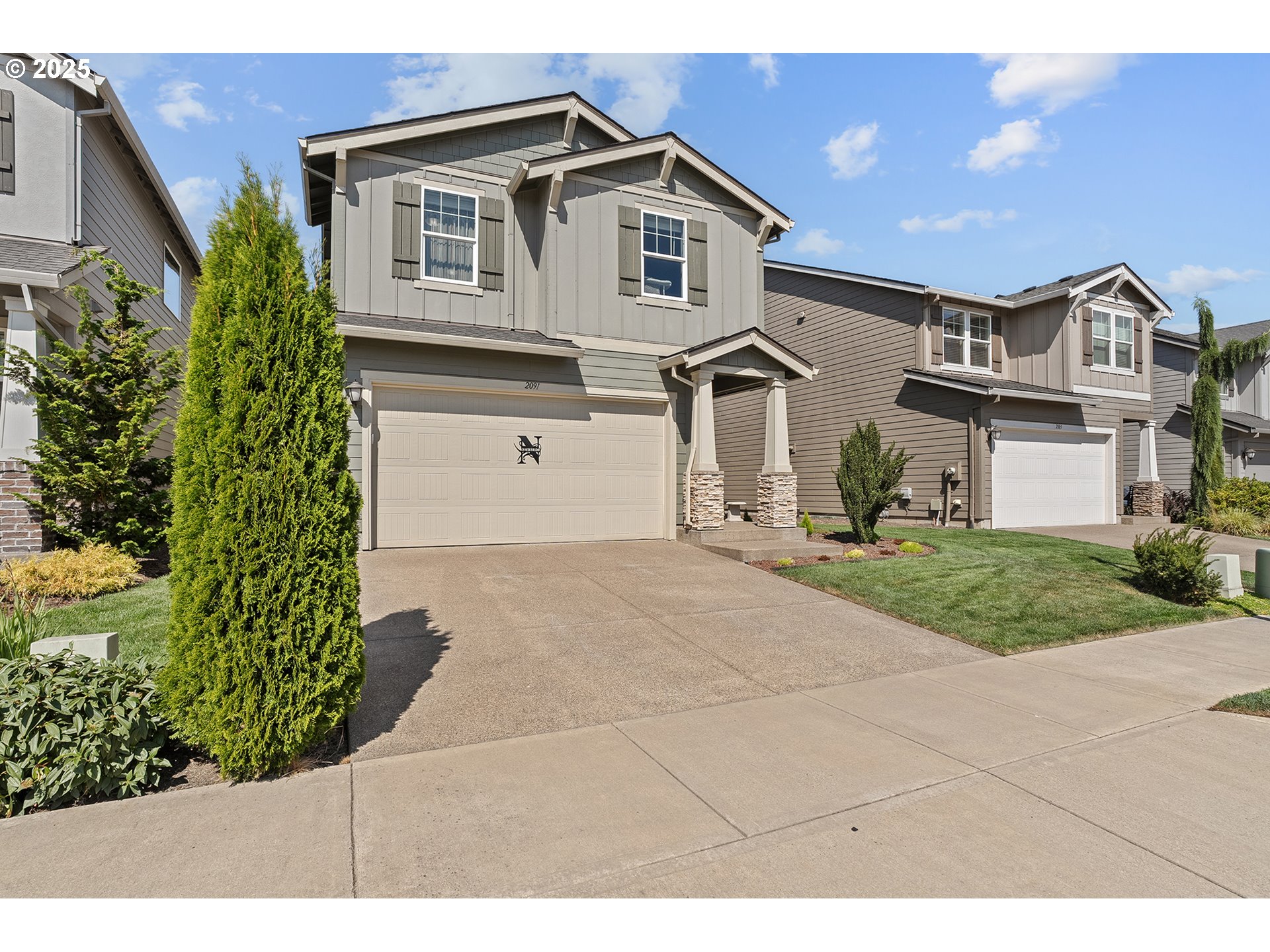 2091 35th Avenue Forest Grove, OR 97116 - Photo 43 of 43 a front view of a house with a garden