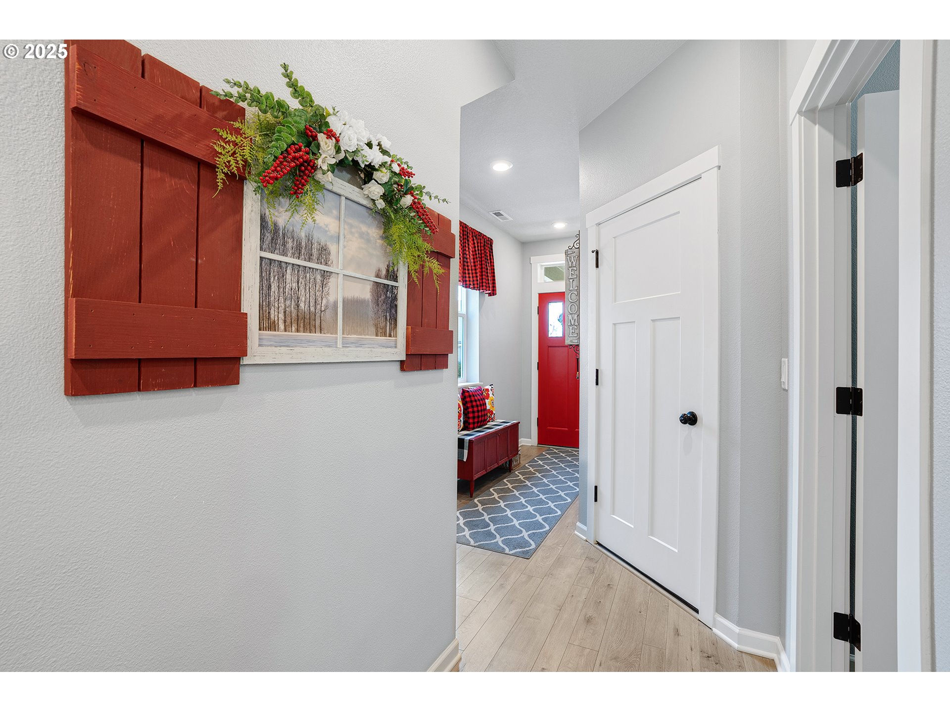 2091 35th Avenue Forest Grove, OR 97116 - Photo 5 of 43 a hallway with beautiful frames and flower vase