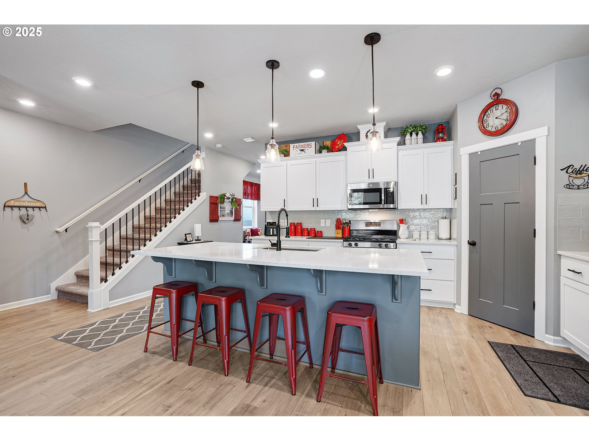 2091 35th Avenue Forest Grove, OR 97116 - Photo 9 of 43 a open kitchen with stainless steel appliances granite countertop a sink dishwasher and a dining table with cabinets