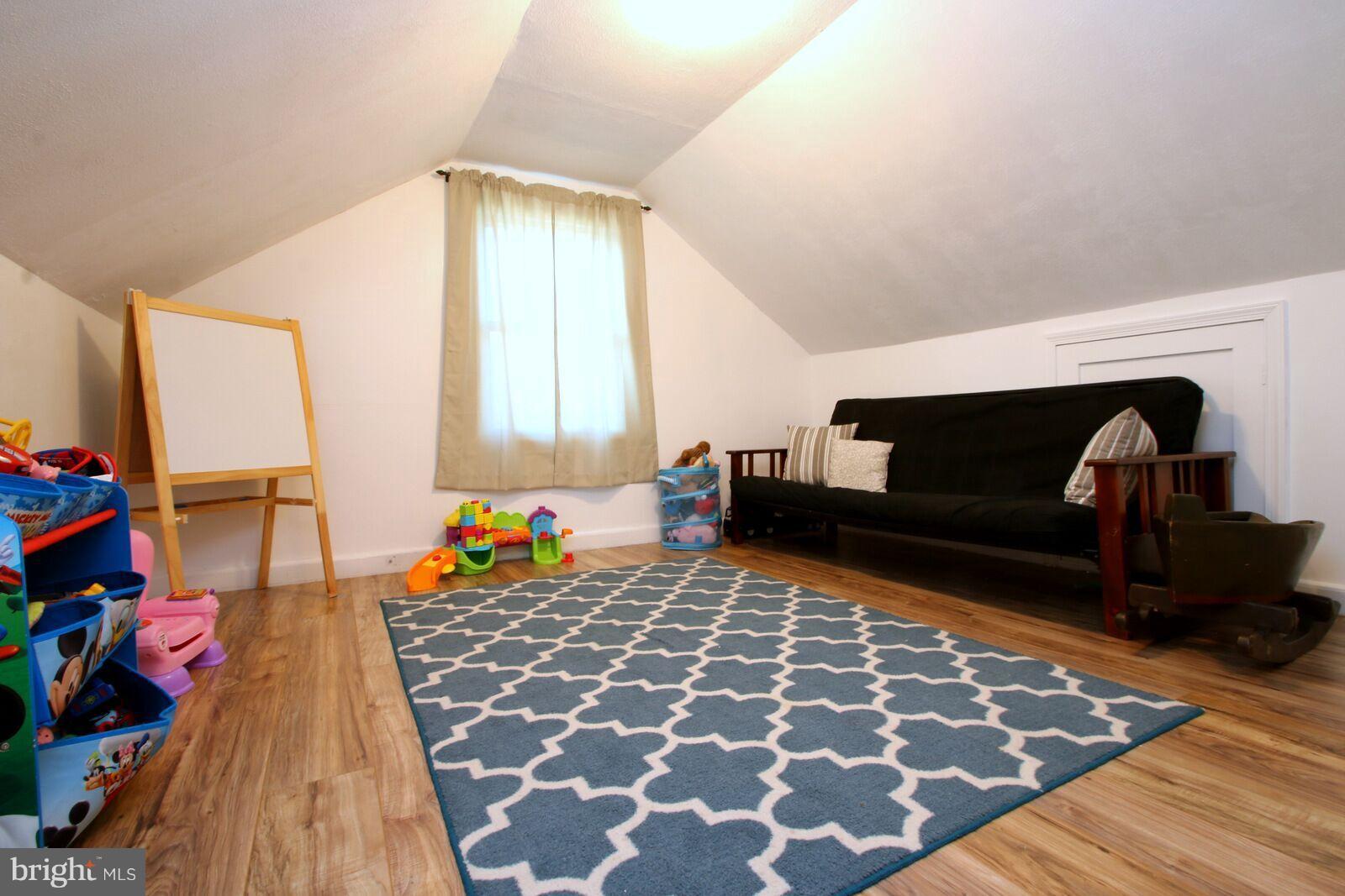 957 Martin Road Baltimore, MD 21221 - Photo 22 of 30 a bedroom with a bed and a fireplace