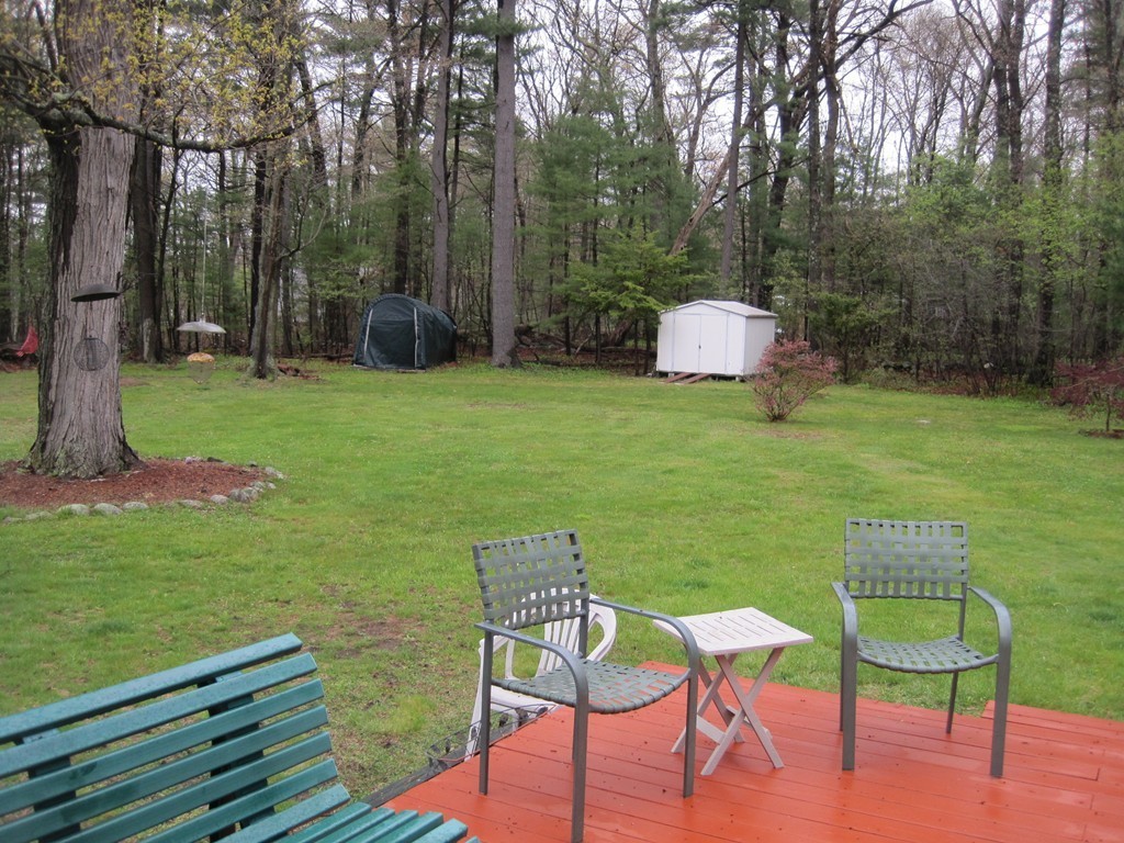 15 Kimbrough Road Billerica, MA 01821 - Photo 13 of 15 a backyard of a house with table and chairs