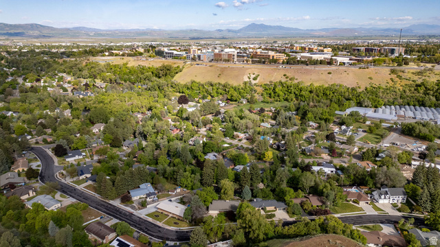 1365 Sumac Drive Logan, UT 84321 - Photo 49 of 66 Aerial perspective showcasing a residential neighborhood with abundant mature trees and curving streets