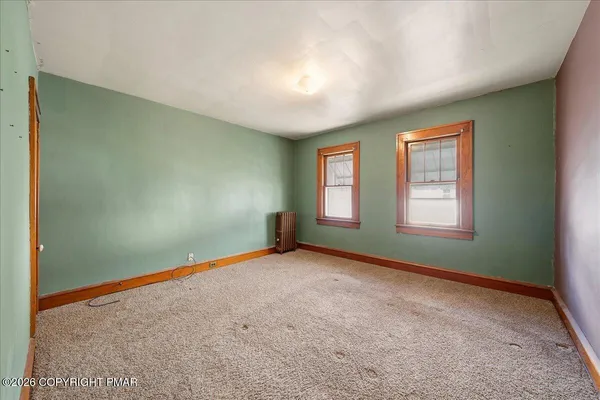 an empty room with windows