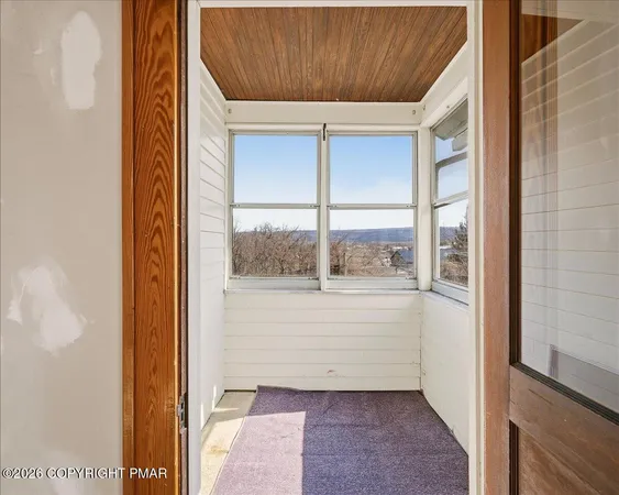 a view of a room with a window