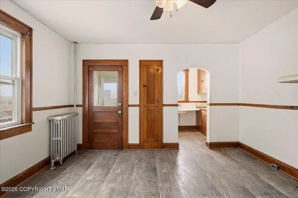 a bathroom with a sink mirror and a bathtub