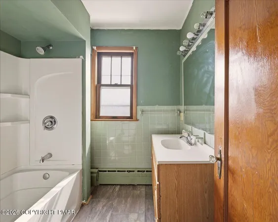 a view of empty room with wooden walls