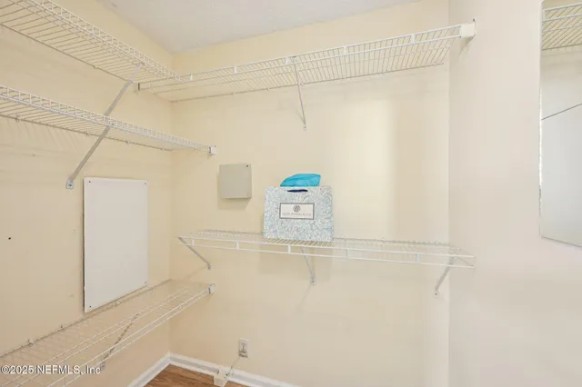 an aerial view of a house with a yard swimming pool and outdoor seating