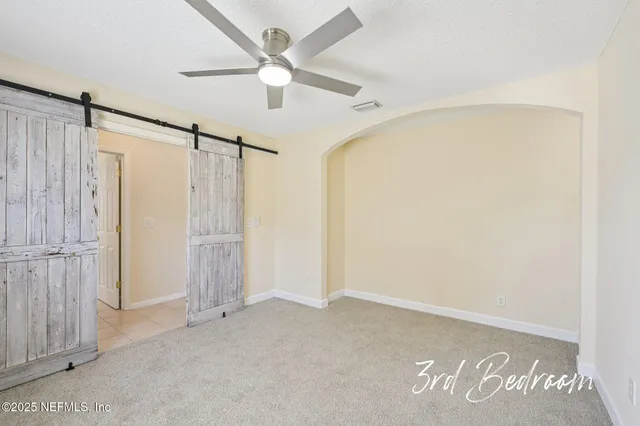 a view of a park with large trees