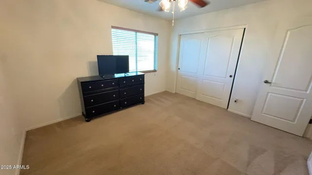 a bathroom with a double vanity sink mirror and toilet