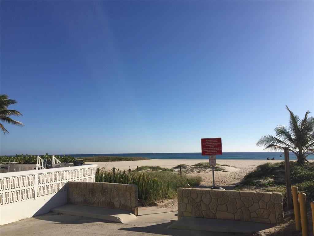 1009 North Ocean Boulevard, Unit 212 Pompano Beach, FL 33062 - Photo 17 of 23 a roof deck with a couch