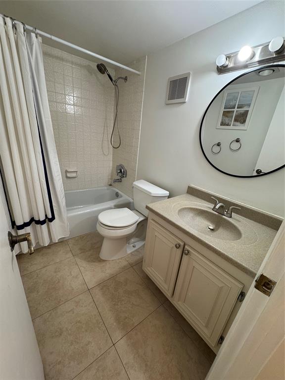 1009 North Ocean Boulevard, Unit 212 Pompano Beach, FL 33062 - Photo 8 of 23 a bathroom with a sink toilet and a mirror