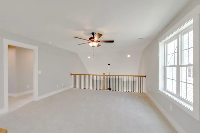 a view of a kitchen with white cabinets