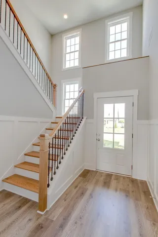 a view of a hallway with entryway door