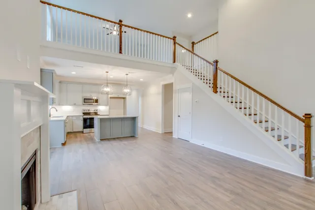 a view of a livingroom with a ceiling fan and window