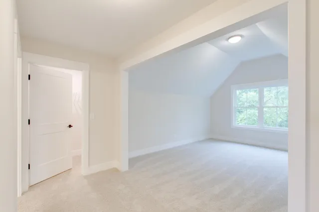 a large kitchen with a lot of counter space and wooden floor