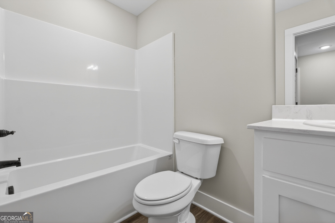 97 Wards Creek Road, Unit 1 Toccoa, GA 30577 - Photo 36 of 55 a white toilet sitting next to a bath tub