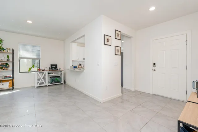 a view of a livingroom with furniture and cabinet