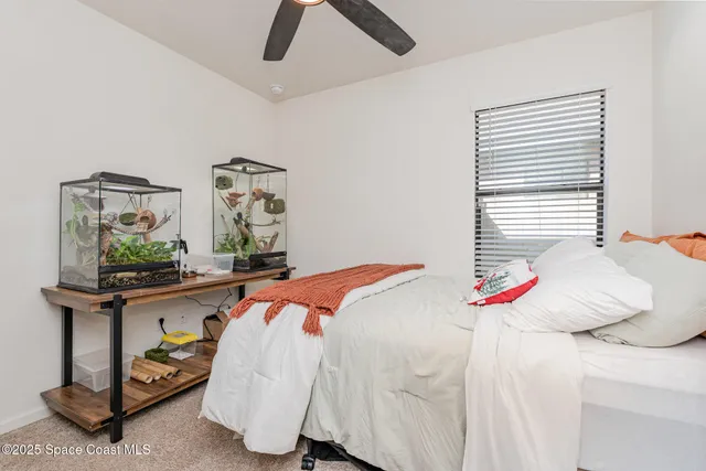 a bedroom with a bed and a table