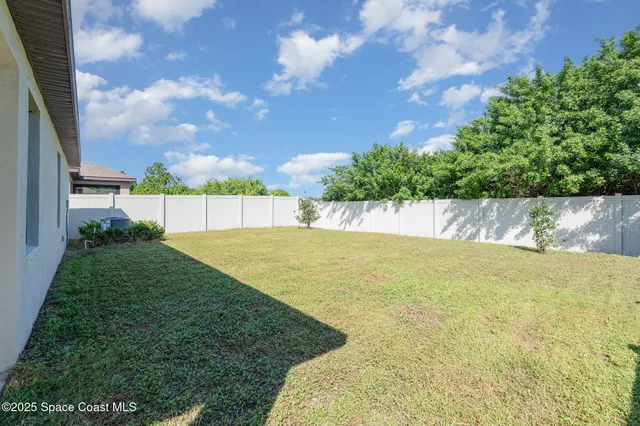 a view of a yard with an trees