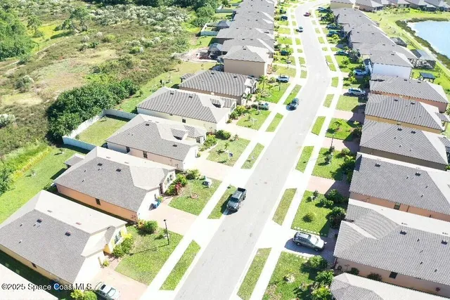 an aerial view of residential house with outdoor space