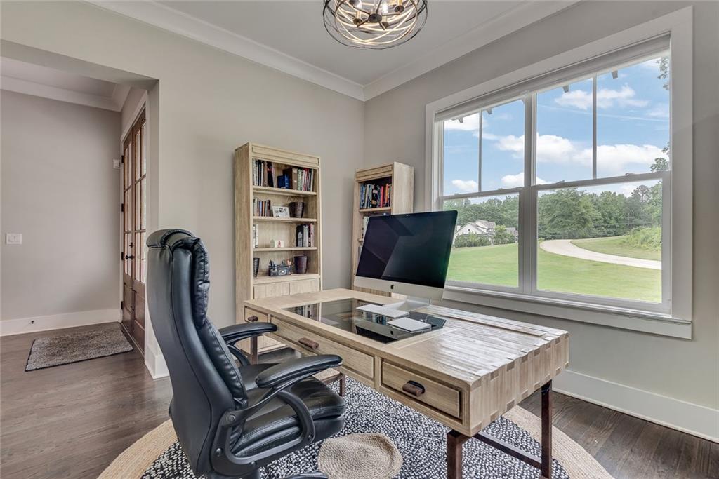 2503 Sugar Pike Road Canton, GA 30115 - Photo 67 of 134 a view of a workspace with furniture and a potted plant