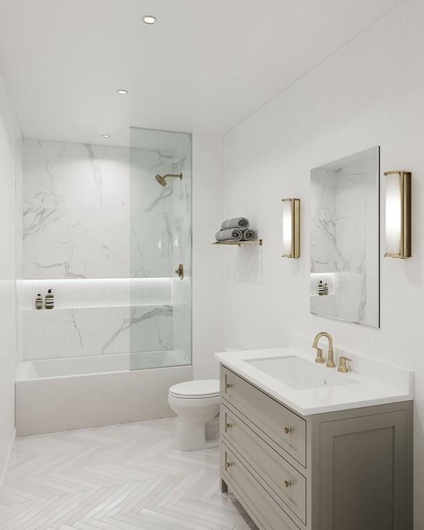 37 Farragut Road, Unit 6 Boston, MA 02127 - Photo 5 of 6 a bathroom with a granite countertop sink a toilet and bathtub