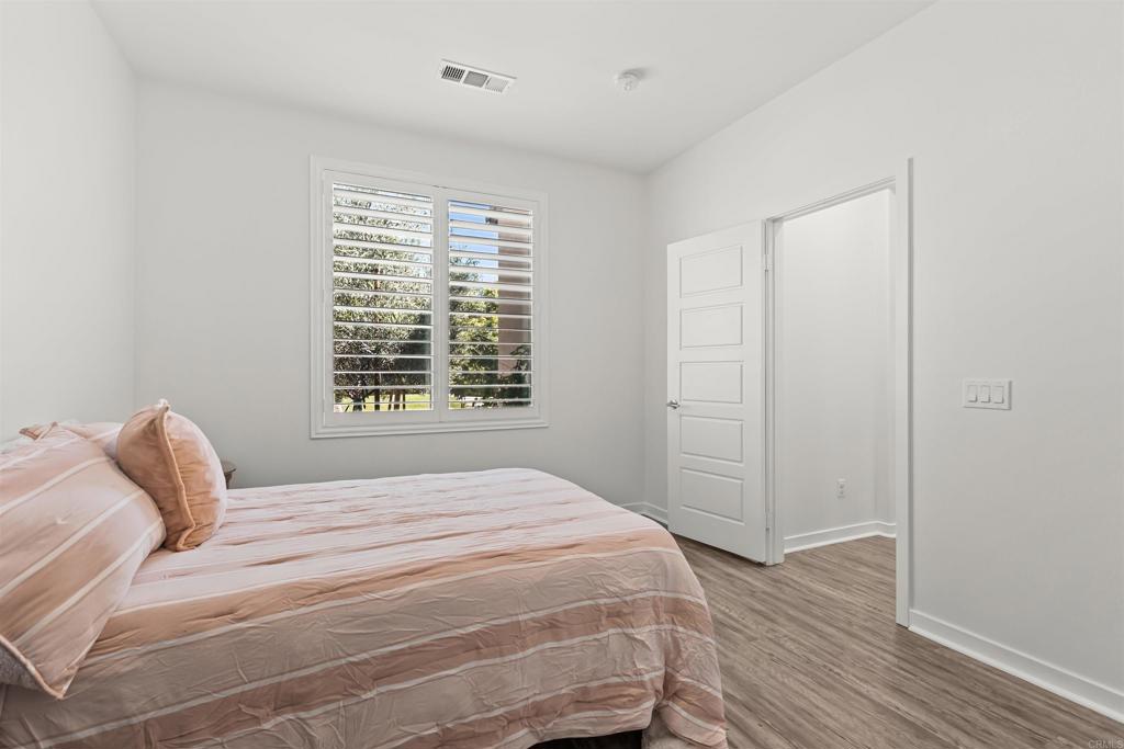 29809 Gypsy Vanner Way Menifee, CA 92584 - Photo 11 of 45 a bedroom with a bed and a window