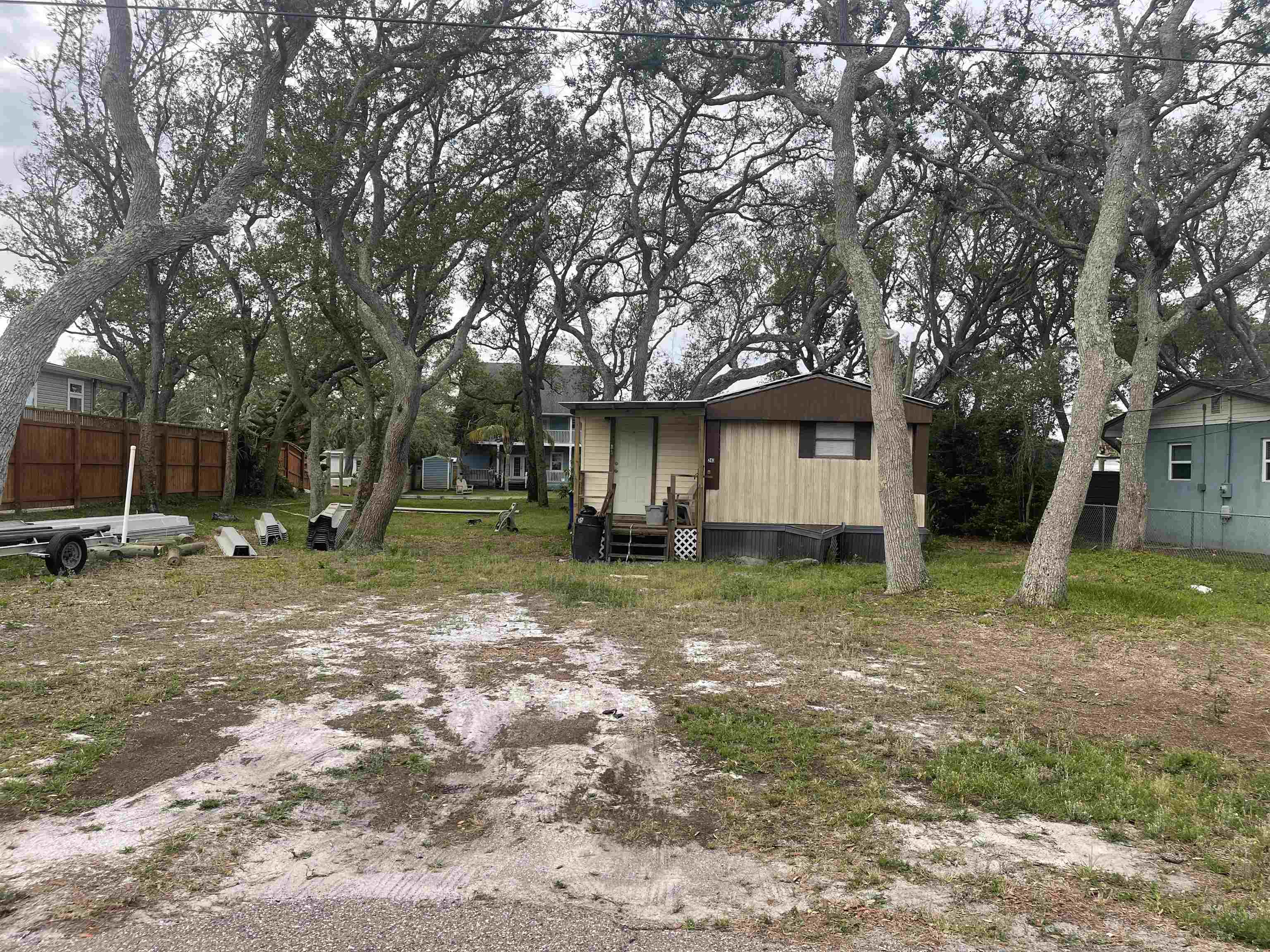 243 Puebla Road St. Augustine, FL 32080 - Photo 1 of 1 a backyard of a house with lots of green space