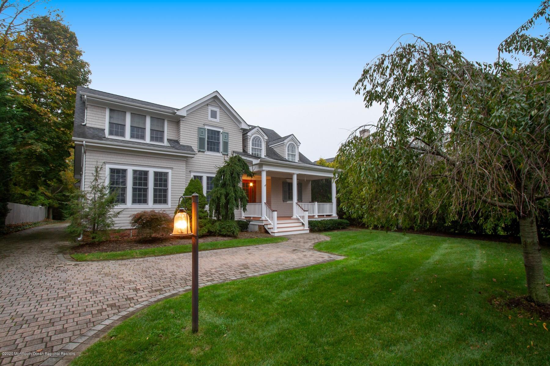 63 River Road Rumson, NJ 07760 - Photo 2 of 37 a view of a house with a yard porch and sitting area