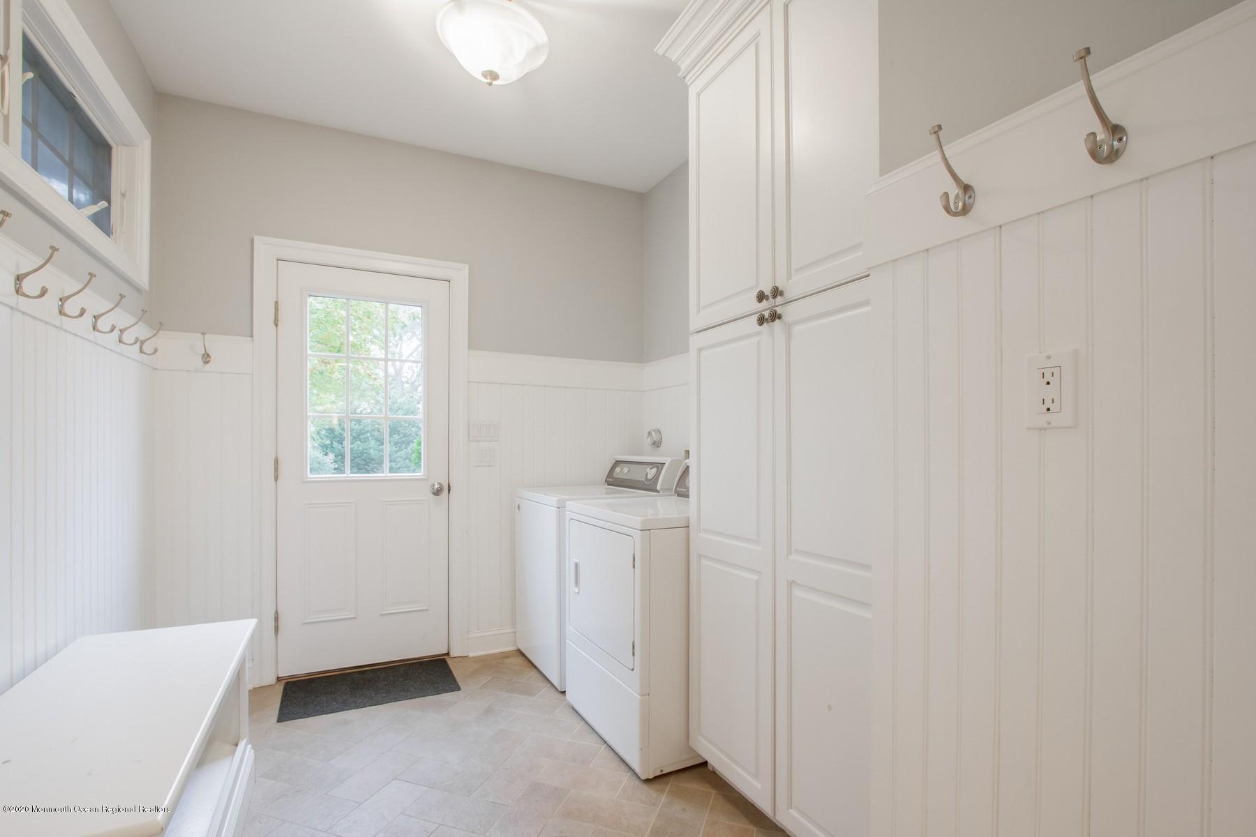 63 River Road Rumson, NJ 07760 - Photo 12 of 37 a view of a hallway with closet and utility room