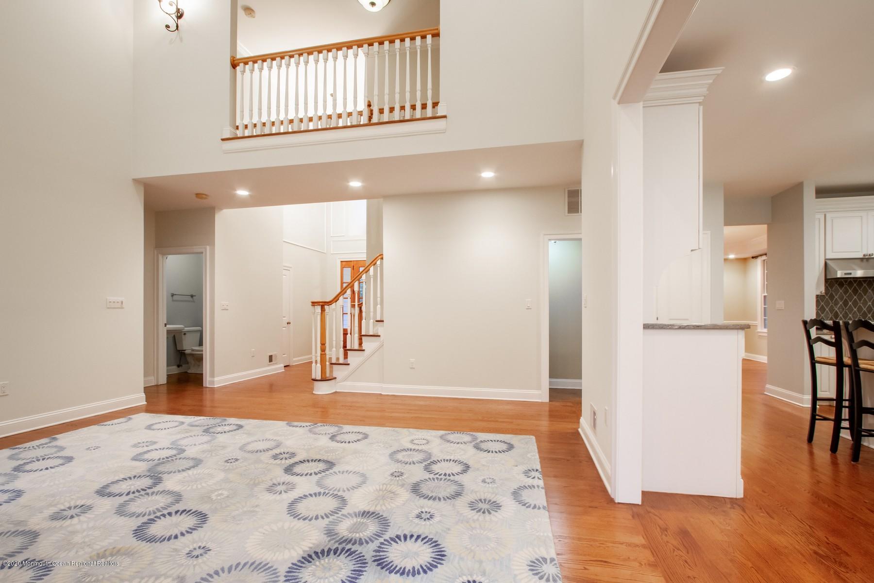63 River Road Rumson, NJ 07760 - Photo 14 of 37 a view of a hallway with wooden floor and dining room